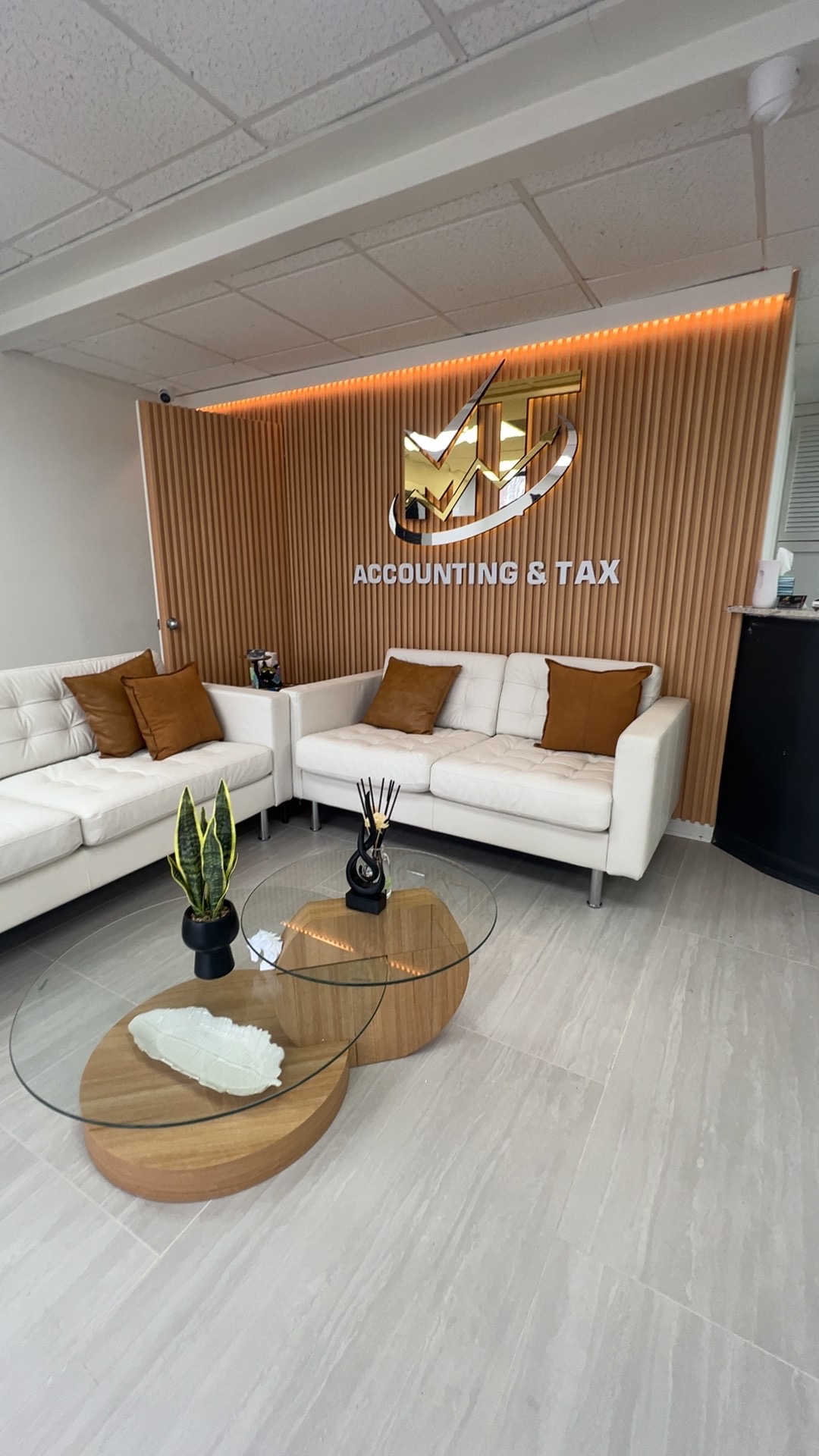 MT Group Memphis office lobby with signature gold logo wall